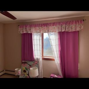 Girls pink Pottery Barn kids curtains and Matching wall photo frames.